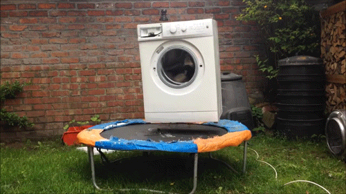 Brick in a Washing Machine on a Trampoline